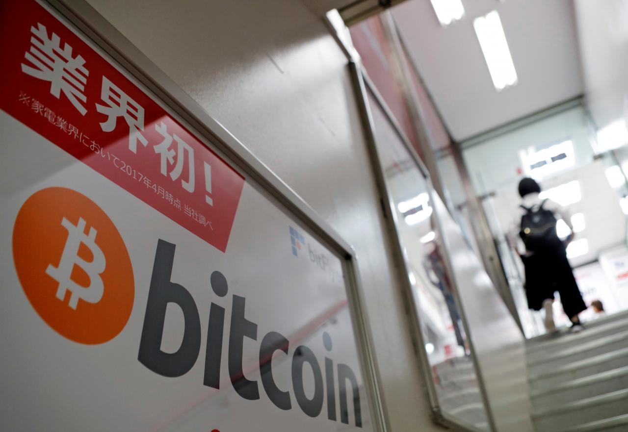 Logo of Bitcoin is seen on an advertisement of an electronic shop in Tokyo