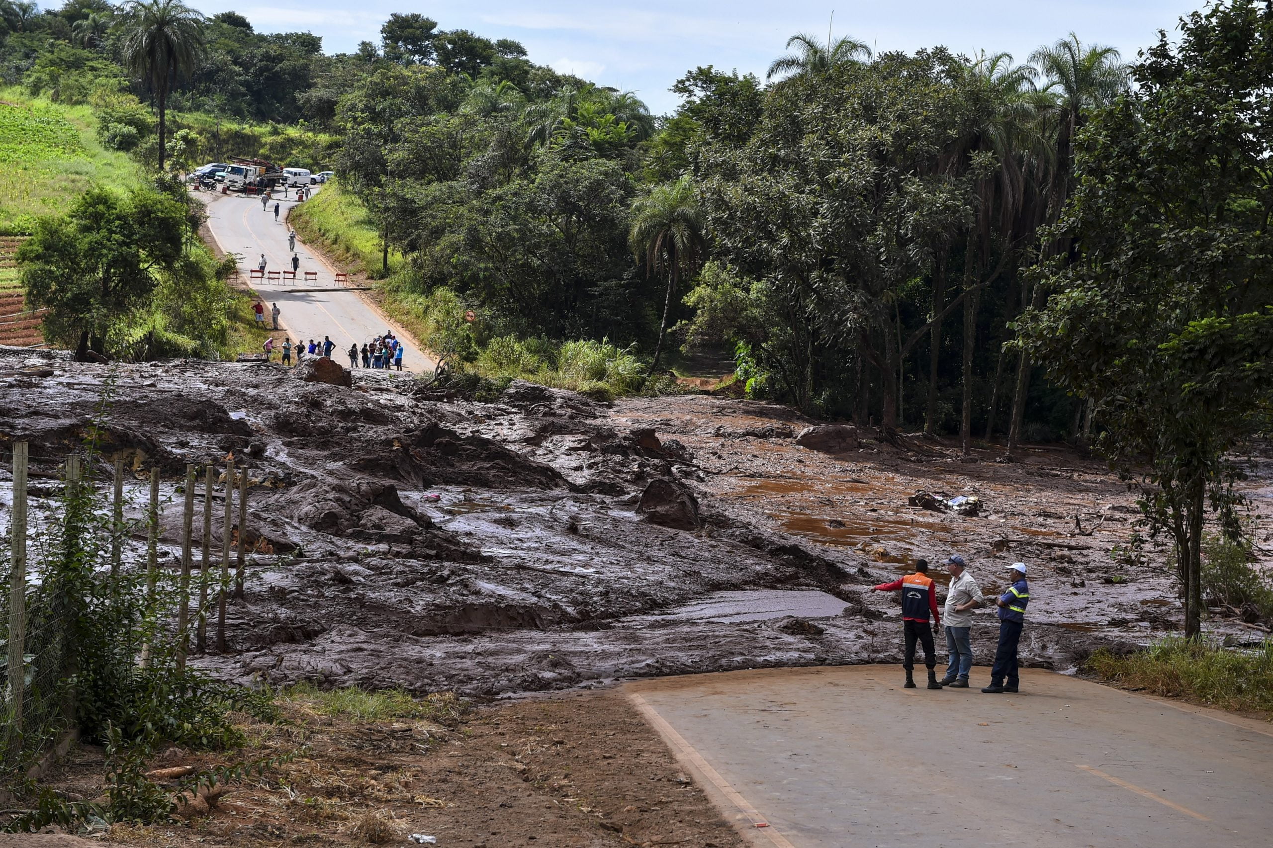 At least 300 missing after mining dam bursts in Brazil