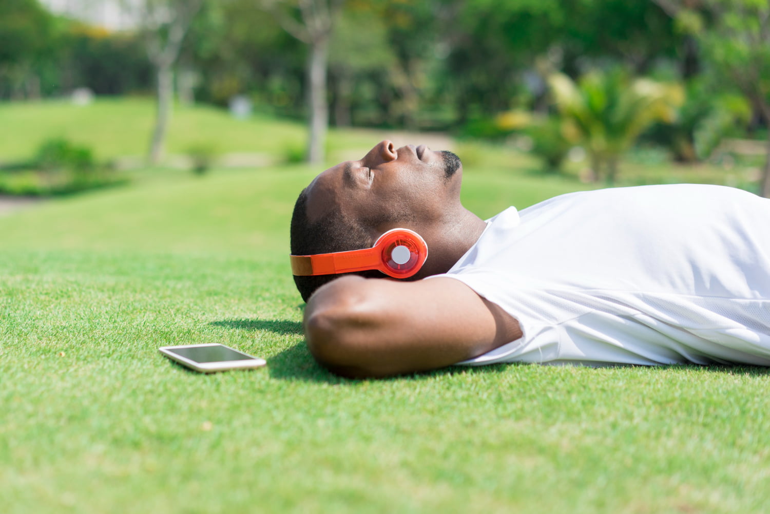 serene-black-man-resting-in-park-and-listening-to-music (1)